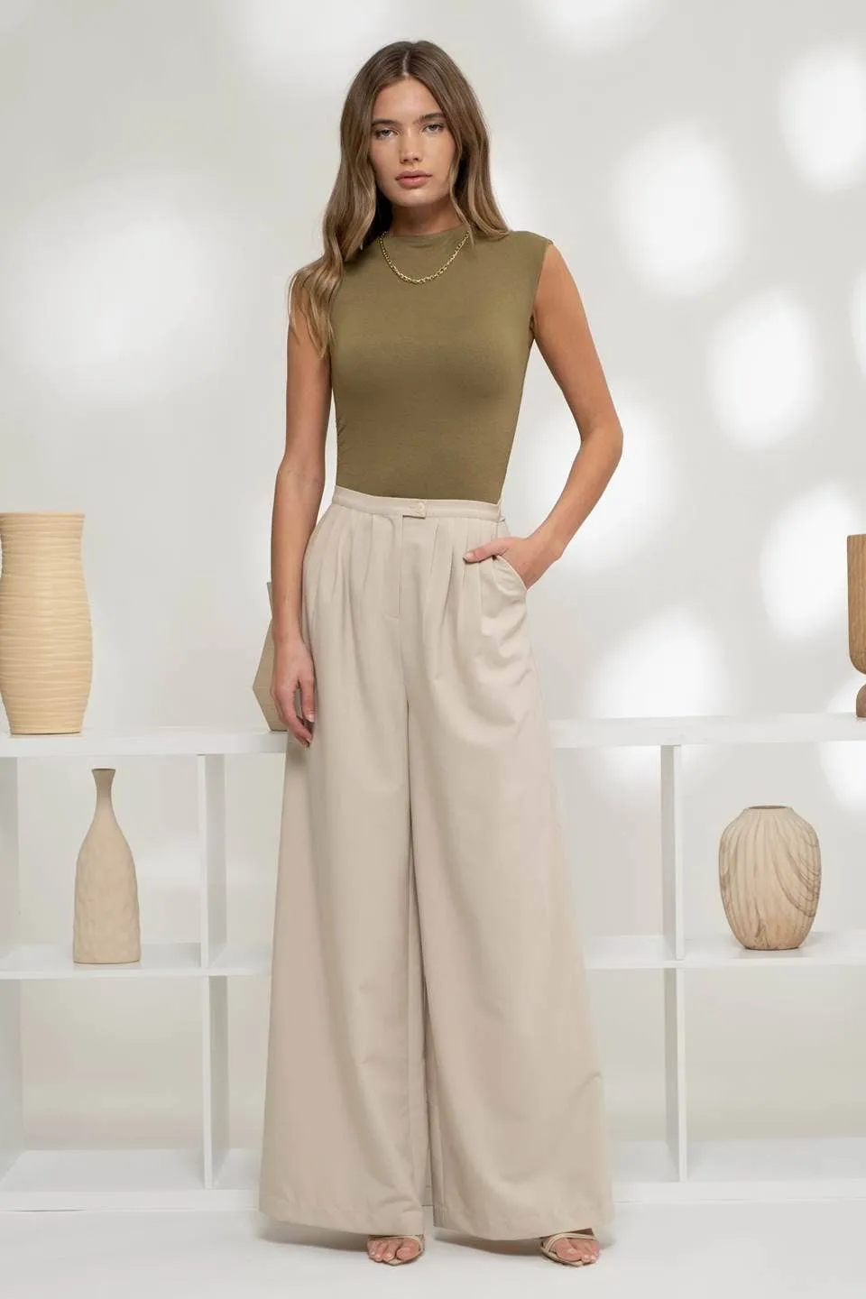 REVERSIBLE MOCK NECK SLEEVELESS KNIT BODYSUIT