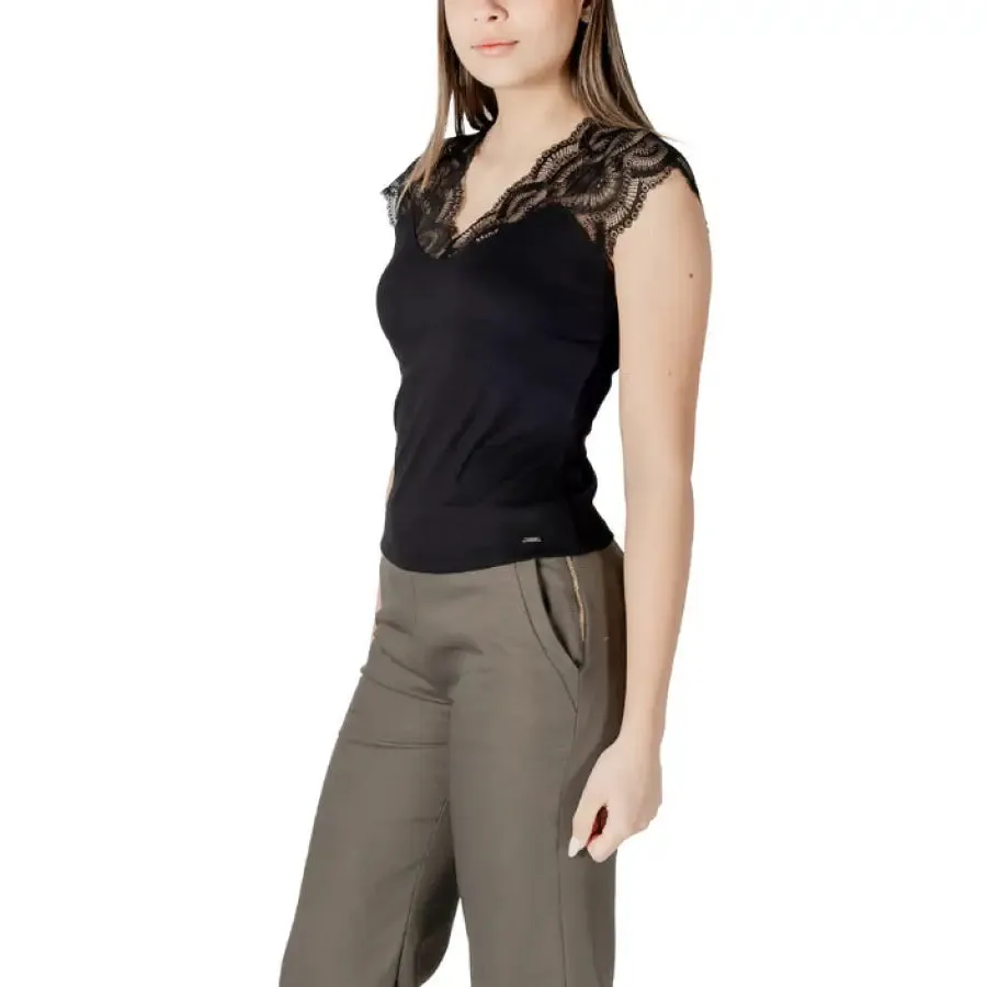Woman in Black Lace Trimmed Top and Khaki Pants